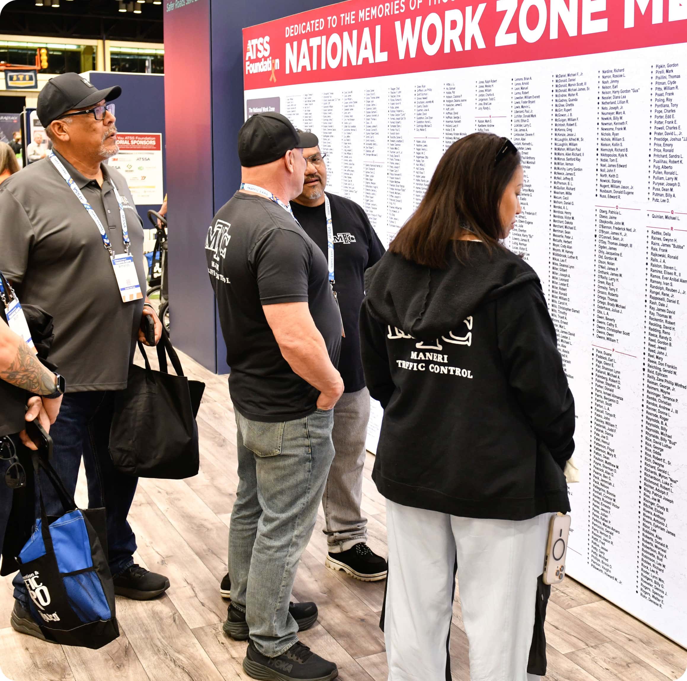 Group of people standing in front of the National Work Zone Memorial in an exhibit hall